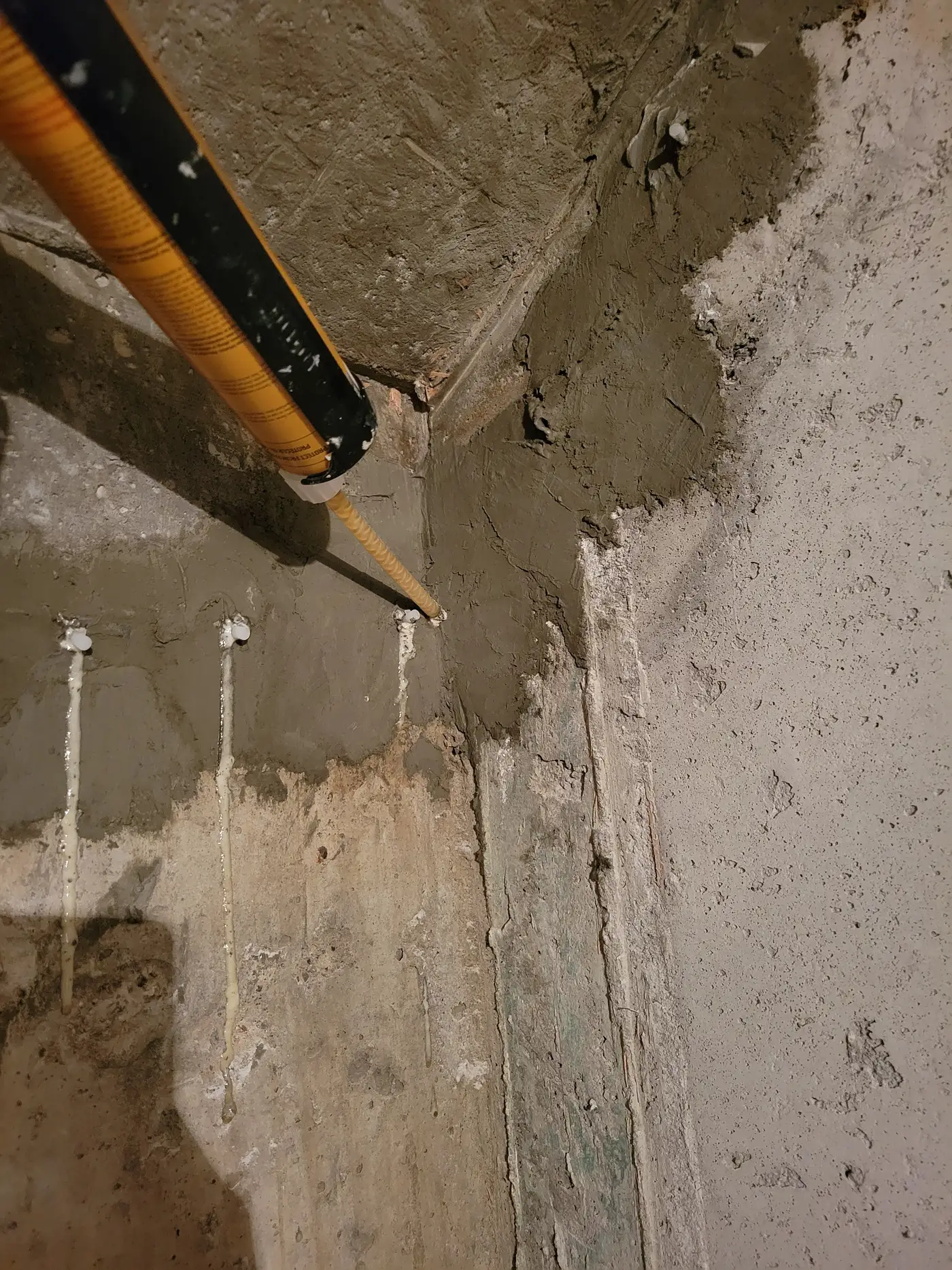 Polyurethane injection port set into a crack in a poured-concrete foundation wall in Newmarket