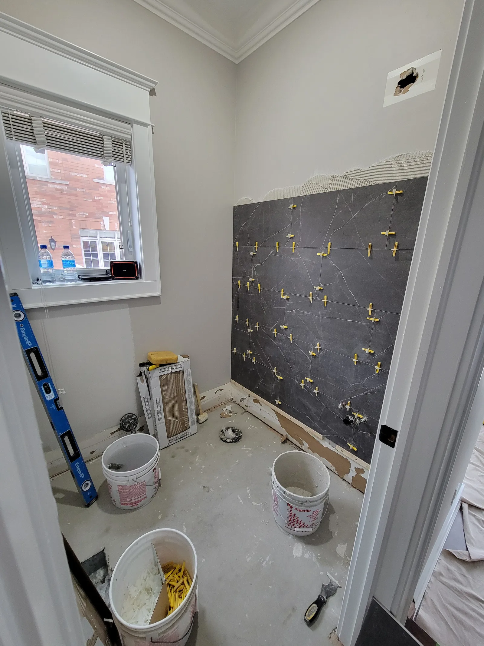 Powder-room floor tile in Newmarket, Ontario by VOL Handyman