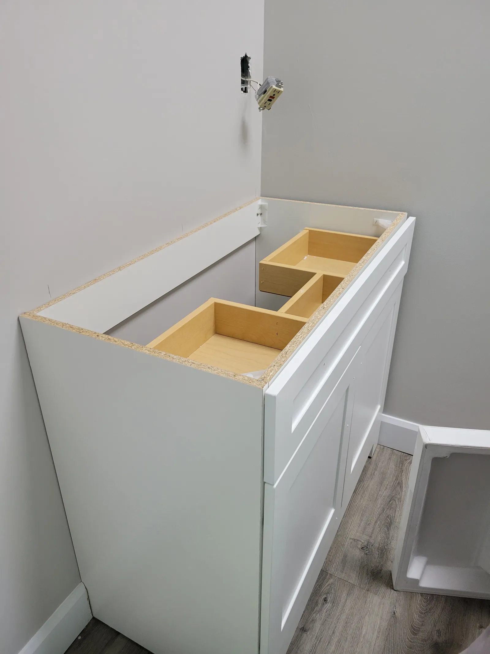 New shaker bathroom vanity cabinet staged and ready for installation in Stouffville